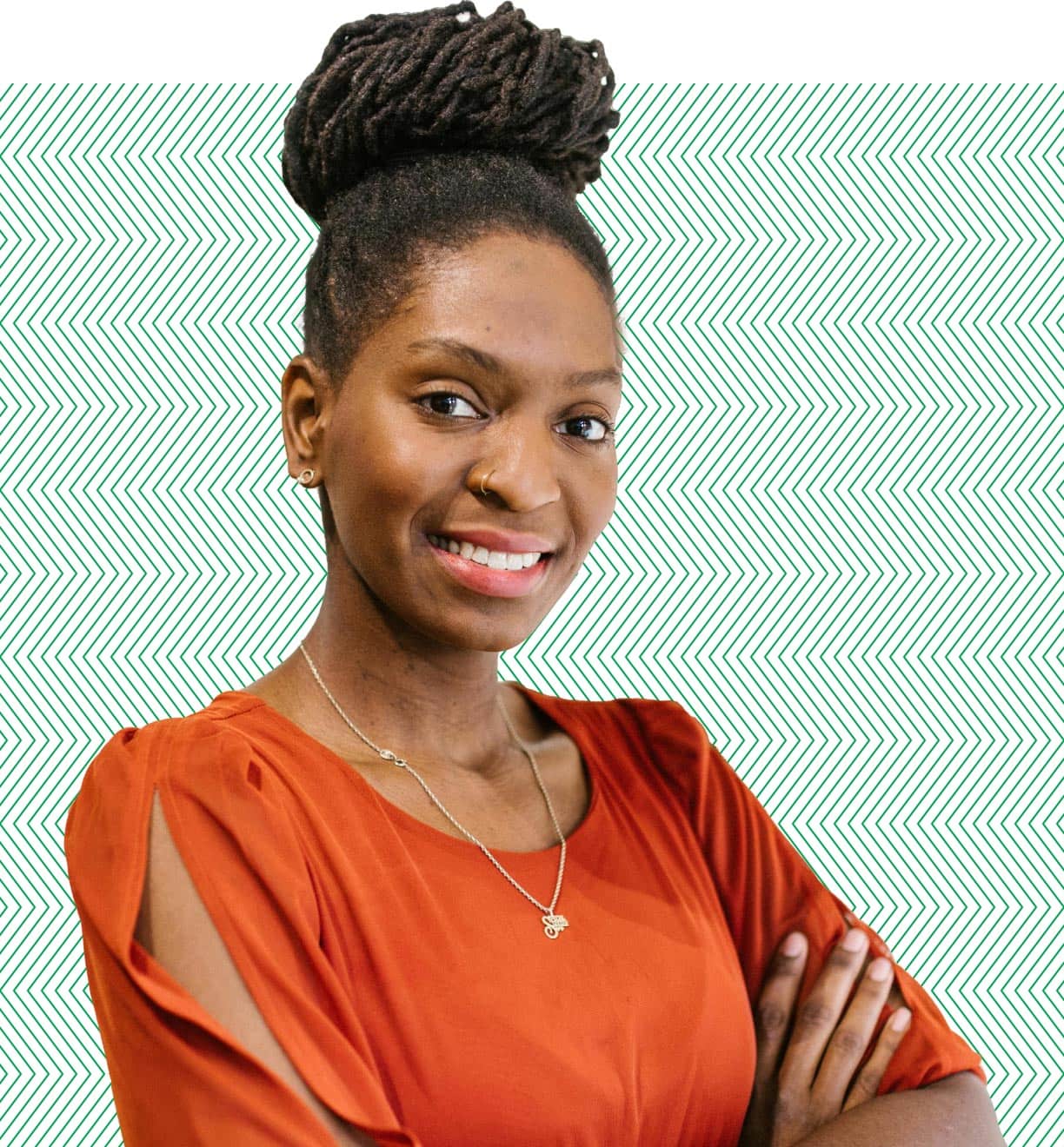 woman with arms crossed similing